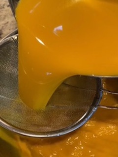 Pouring through the small strainer